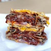 Western Hot Sandwich · Smoked roast beef, thick-cut bacon, sharp cheddar cheese, grilled onions, and Dad's sweet an...
