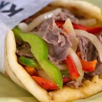 Philly Cheesesteak Pita · Ribeye Steak, Grilled Onions, Green and Red Peppers, Provolone Cheese, Pita Bread