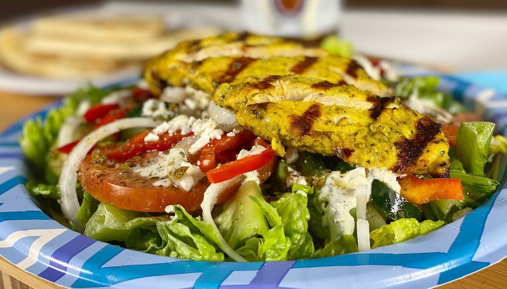 Chicken Salad · Grilled chicken, with a blend of lettuce, tomatoes, onions, red and green peppers, cucumbers, feta cheese, kalamata olives and a twist of our homemade house dressing.