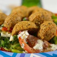 Falafel Salad · Falafel, with a blend of lettuce, tomatoes, onions, red and green peppers, cucumbers, feta c...