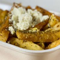 Greek Fries · French fries with feta cheese and house dressing.