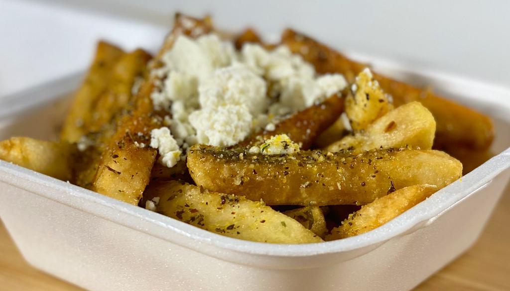 Greek Fries · French fries with feta cheese and house dressing.