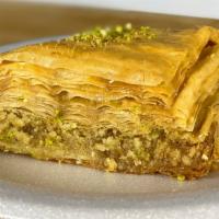 Honey Walnut Baklava · Made with layers of crispy filo dough, walnuts, and heavy honey syrup. Hand-crafted by highl...