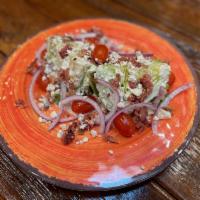 Wedge Salad · 1/2 head of tender, crisp baby iceberg lettuce, topped with sliced red onion, fresh grape to...