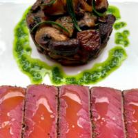 TUNA TATAKE A LA PLANCHA  · Pepper-crusted rare Saku Tuna, wild mushrooms fricassée, fresh herbs infused French olive oil
