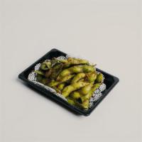 Spicy Edamame · Young soybeans sauteed with butter and chili sauce sprinkled with sea salt.