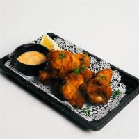 Chicken Wings · Deep-fried chicken wings (choice of spicy or teriyaki).