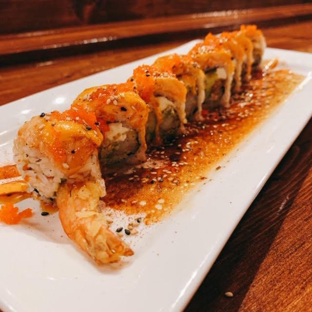*Sexy Salmon Roll · Spicy crab salad, shrimp tempura, seared salmon, cream cheese, avocado, masago, scallions, spicy mayo, unagi and Japanese sweet mustard.