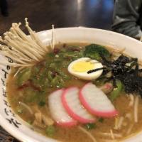 Shoyu Ramen · Soy-based soup broth with seaweed, fish cake, bamboo shoot, bean sprout, boiled egg and gree...