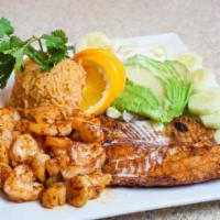 Los Cabos Seafood · Grilled tilapia, scallops and and avocado salad.
