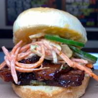 BBQ Roast Pork Belly Sandwich · Served with Asian slaw with tangy 5 spiced BBQ sauce on soft potato roll.