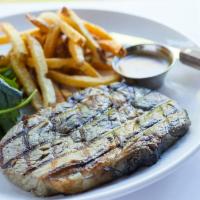  Ribeye Steak and  Frites · 10 oz cooked to order served with salad, fries, peppercorn sauce