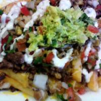 Asada Fries · Served with your choice of meat, beans, cheese, pico de gallo, sour cream and guacamole.
