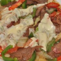 Alambre · Tender grilled beef, with chopped bacon, grilled onions, grilled bell peppers, cheese, serve...