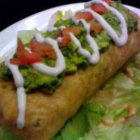 Grande Chimichanga · Deep-fried burrito with your choice of meat, beans and cheese, topped  with guacamole, sour ...