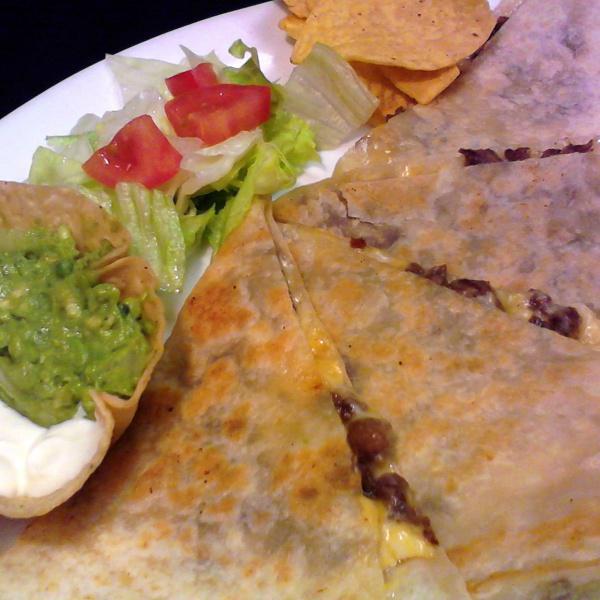 Meat Quesadilla · Made with flour tortilla, monterrey/jack cheese, served with a side of sour cream, guacamole and chips