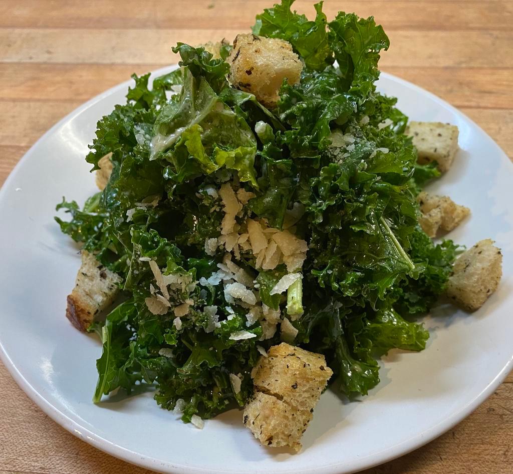 Kale Caesar Salad · Parmesan, housemade croutons, anchovy dressing