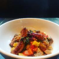Ratatouille with MERGUEZ · Provencal Vegetable Stew served with farro and Merguez Sausages