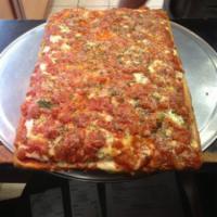15. Sicilian Marinara Pizza · Deep Dish upside down Sicilian pizza with sautéed onions in sauce (12 slices)