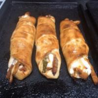 Sausage Roll · Pizza dough rolled with fresh sauteed Italian sausage, roasted red peppers and mozzarella ch...