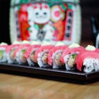 Sakura Roll Special · Snow crab and avocado wrapped in tuna and topped with chef sauce.