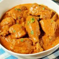 Chicken Korma · Chicken cooked in moderately spiced cream sauce with nuts.
