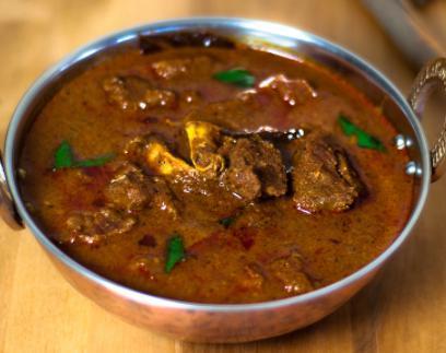 Goat Curry · Baby goat cooked in traditional, and homemade spices.