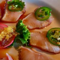 Hamachi Jalapeno · Thin slices of Japanese yellow-tail topped with jalapeno peppers, and cilantro with yuzusoy ...