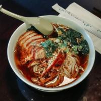 Crispy Duck Noodles Soup · Rice noodles, fried crispy duck, Chinese broccoli, preserved cabbage, crispy garlic, and sca...
