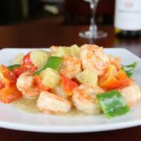 Topical Taste Shrimp · Pineapples and peppers garnished with a touch of black pepper. 