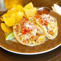 Fish Tacos · Beer battered cod in a cheesy corn tortilla topped with baja slaw, pico de gallo and cotija ...