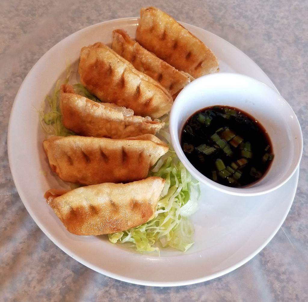 A5. Banh Xep - Potstickers · Potstickers. Chicken and vegetable potstickers deep fried and served with soy sauce.