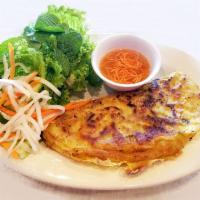 A6. Banh Xeo - Saigon Crepe · Saigon crepe. Pan-fried rice flour crepe filled with shrimp, pork, and bean sprouts served w...