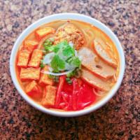 65. Bun Rieu · Crab noodle soup. Crab noodle soup with fried tofu, Vietnamese pork roll, real and imitation...