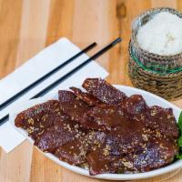 14. Seen Savanh (Lao Beef Jerky) · Sweet and savory Laotian beef jerky served with sticky rice.