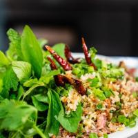17. Nam Khao Tod · Spicy pork crispy rice with lettuce, cilantro and peanut.