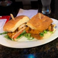 Jerk Chicken Sandwich · Served on toasted coco bread with lettuce, tomato and ranch dressing.