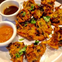 Mixed Vegetable Pakora · Mixed vegetables fritters fried in a chickpea batter.