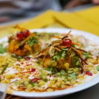 Chaat Papri · Crisp fried dough wafers along with boiled chickpeas, boiled potatoes, yogurt and tamarind c...