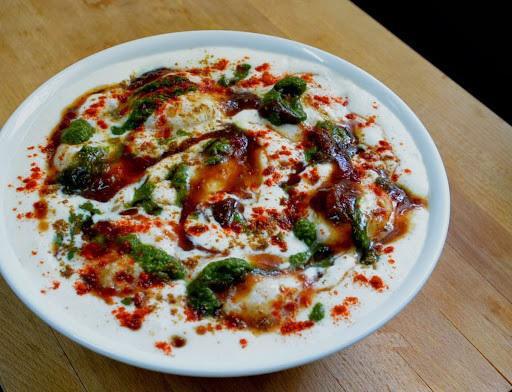 Dahi Bhalla Chaat · Lentil cakes covered with whipped yogurt, aromatic spices and chutneys.
