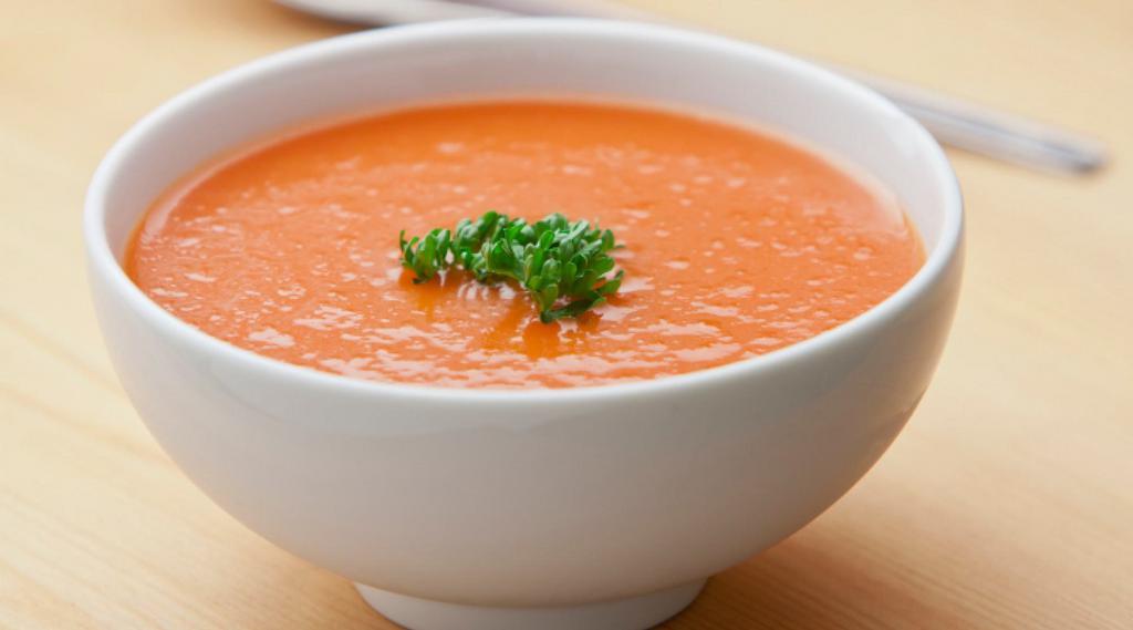 Tomato Soup · Traditional tomato soup flavored with herbs and spices.
