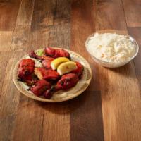 Tandoori Chicken Full · Chicken chunks marinated and broiled over traditional clay oven.