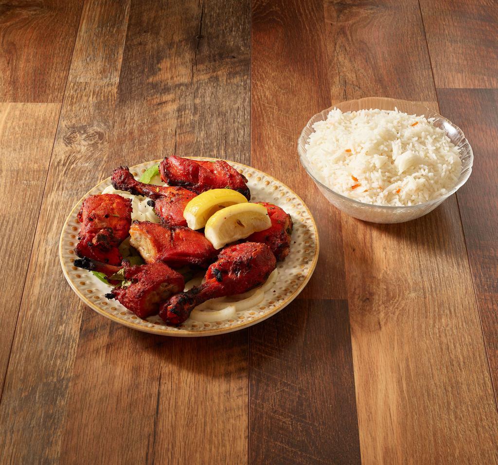 Tandoori Chicken Full · Chicken chunks marinated and broiled over traditional clay oven.