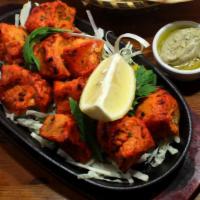 Chicken Tikka Full · Tender chunks of boneless chicken seasoned with heavenly spices and BBQ in traditional clay ...
