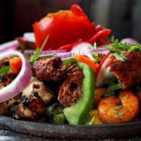 Tandoori Mixed Grill · Platter, offering tandoori chicken, tandoori shrimp, seekh kebab and boti kebab. 2 pieces ea...