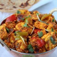 Paneer Masala Curry · Homemade cheese sauteed with onions, bell peppers and chilies.