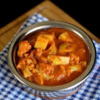 Aloo Gobi Curry · Potatoes and cauliflower sauteed with a spicy tomato and onion sauce.