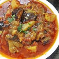 Aloo Baingan Curry · Eggplant and potatoes sauteed with a special tomato and onion sauce.