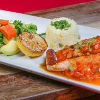 Salmon Cancun · Salmon filet grilled in a tasty mango citrus glaze, served with white rice & a vegetable med...