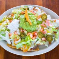 Supreme Nachos · Beans, cheese, lettuce, tomatoes, guacamole, jalapeno and sour cream.